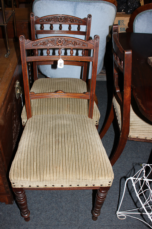 A set of six Edwardian dining chairs with spindle back and upholstered seats