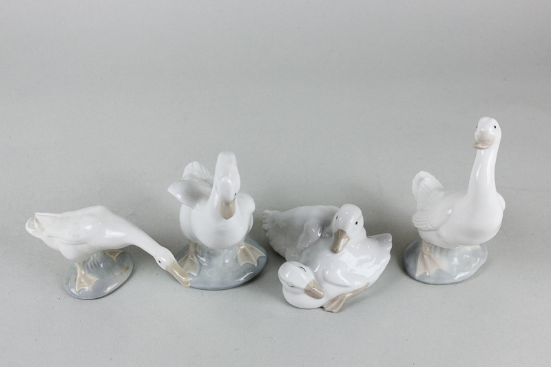 Three Nao goose ornaments and a similar Lladro ornament