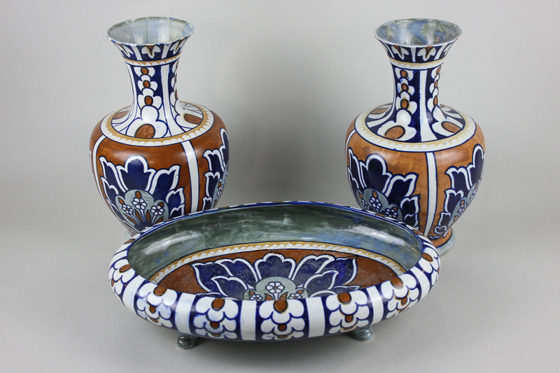 A pair of Bursley Ware `Baghdad` pattern vases and matching oval bowl decorated with panels of