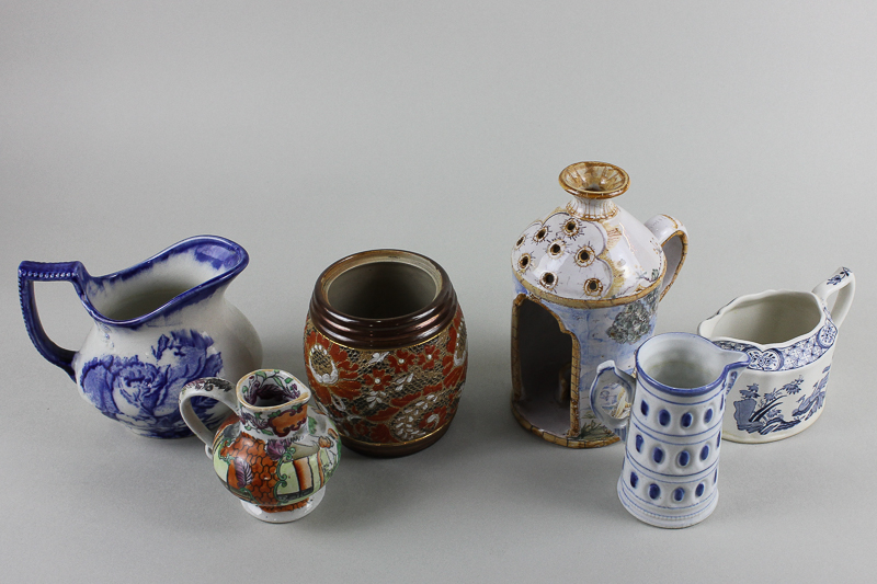 A set of three copper lustre jugs, four other jugs including Mason Ironstone, a Doulton stoneware