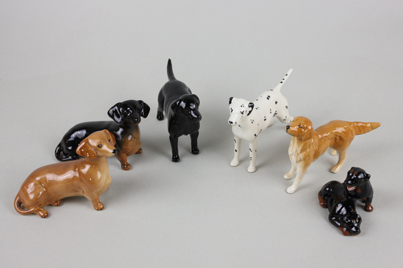 Six small Beswick dogs including Dalmation 1763, two seated Dachshunds, one in each colour way,