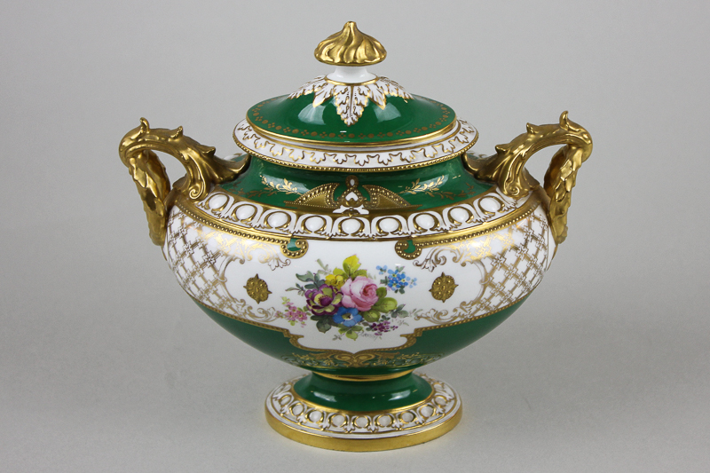 A Royal Crown Derby porcelain two-handled vase and cover, oval form, in green glaze decorated with