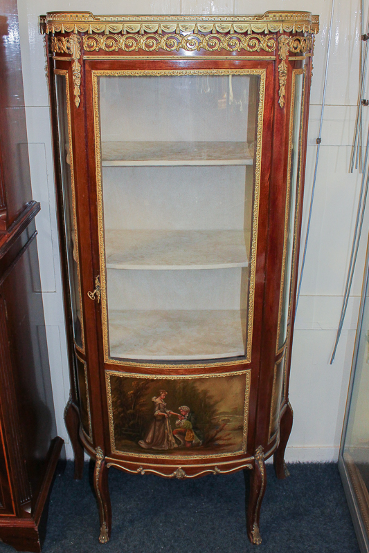 A 20th century French style vitrine with bow front and shaped sides, the glazed door and sides with