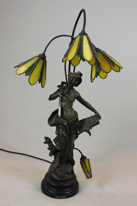 A French bronzed spelter figure table lamp, `La Pensee` modelled as a young lady with light at her