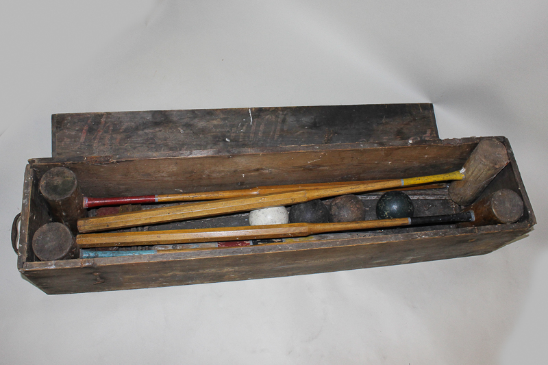 A boxed croquet set of four mallets, balls, metal hoops and pegs (a/f)