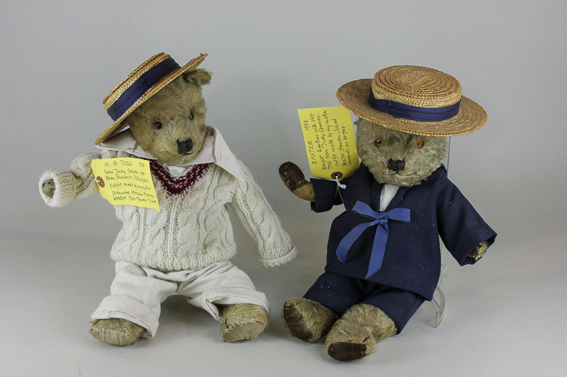 Two 20th century teddy bears, one in cricket, one in sailor`s outfit, both wearing straw boater