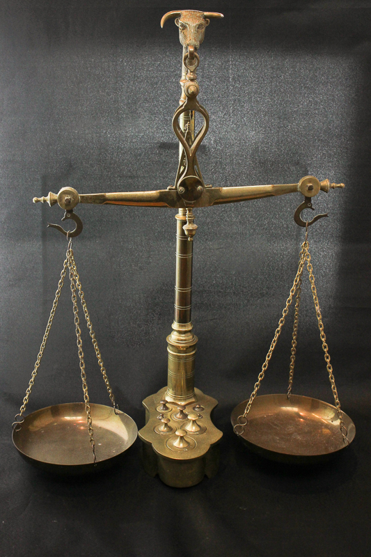 A set of brass scales, central column with head of a bull, 56cm