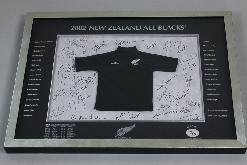 A New Zealand All Blacks 2002 Insignia Limited Edition 107/200 miniature shirt and signatures of