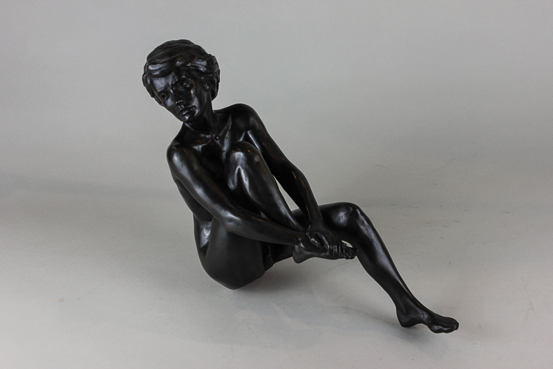 Tom Greenshields, a limited edition resin bronzed figure, 103/500, of a naked lady seated holding