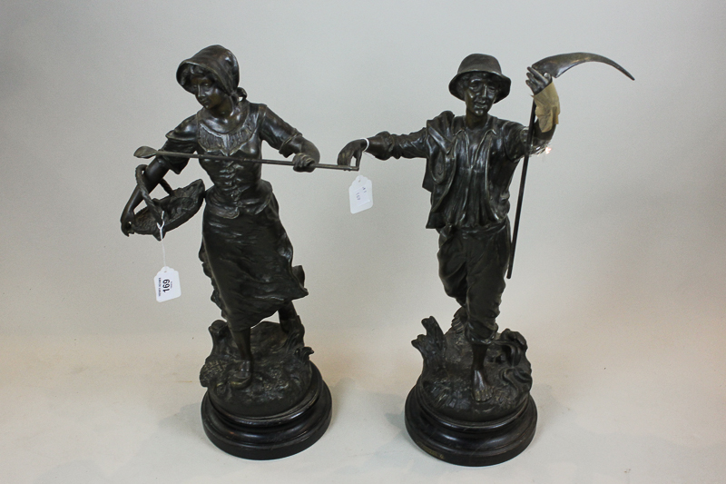 A pair of victorian bronzed spelter figures of harvesters, she with horn and basket, he with