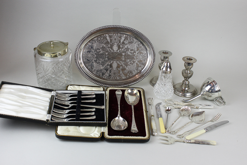 A plated wine funnel; a glass and plate mounted biscuit barrel, a pair of serving spoons, a bottle