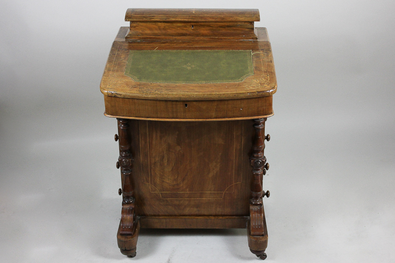 A Victorian inlaid Davenport with green leather inset top, four side drawers on turned supports,