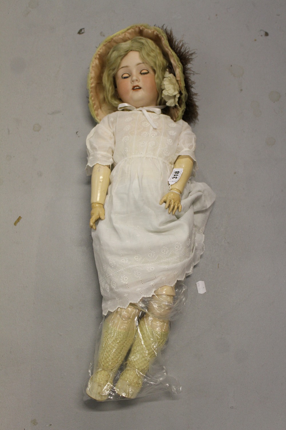 Dolls: Otto Reinecke bisque headed doll. Composition body, moveable limbs, opening eyes and mouth.