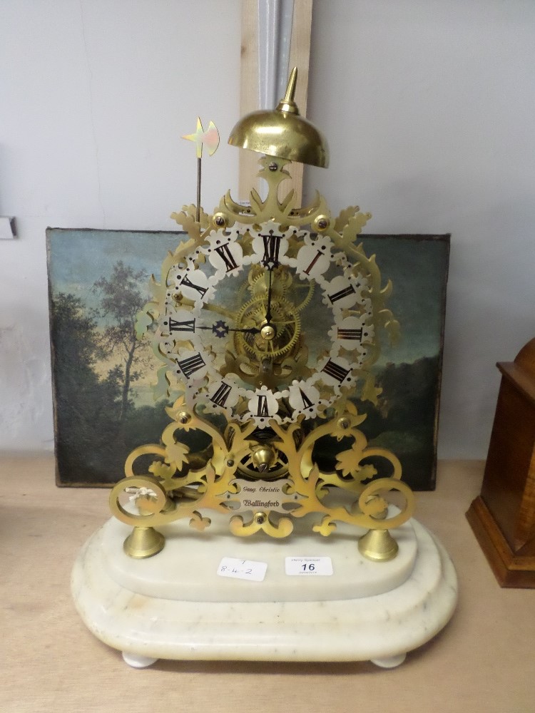 A Victorian Skeleton clock Duly mounted on a marble base, with passing strike pendulum & key chain