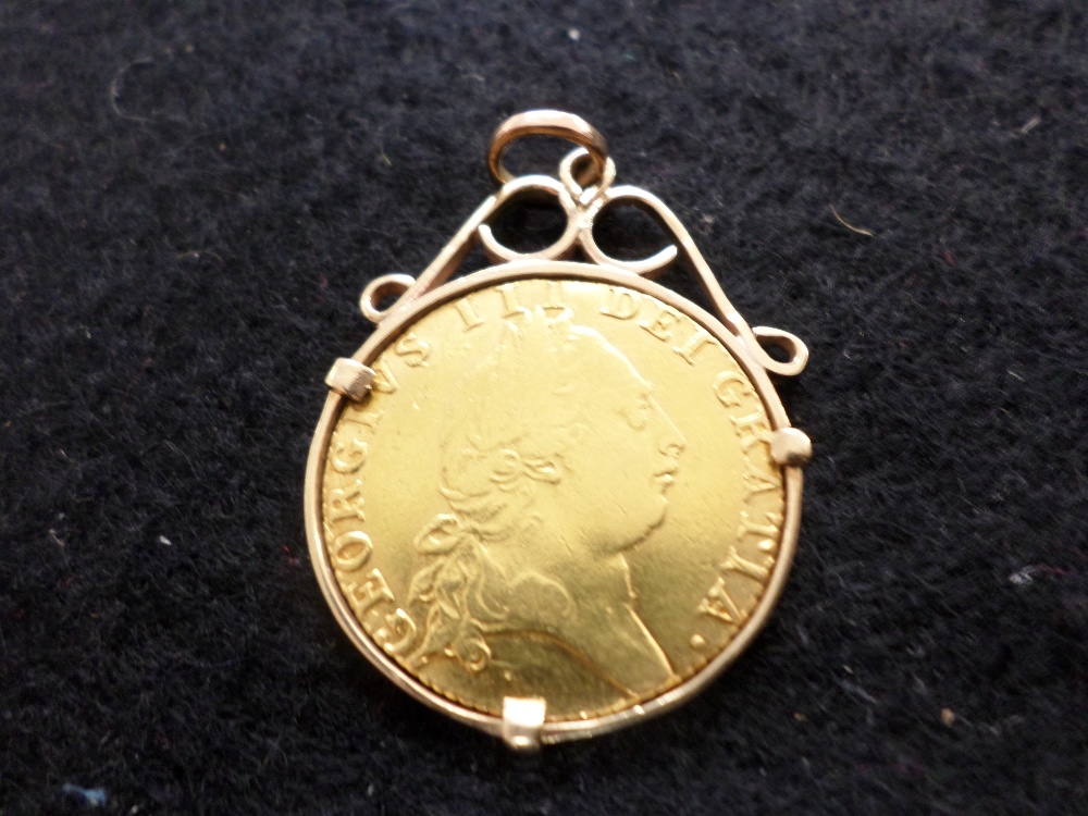 George III gold guinea in gold mount, dated 1790