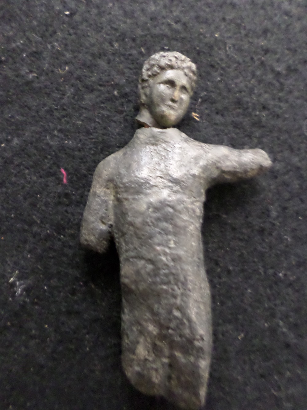 Roman bronze statue. 1st-4th century A.D. The head has been broken off but can be repaired. 80mm.