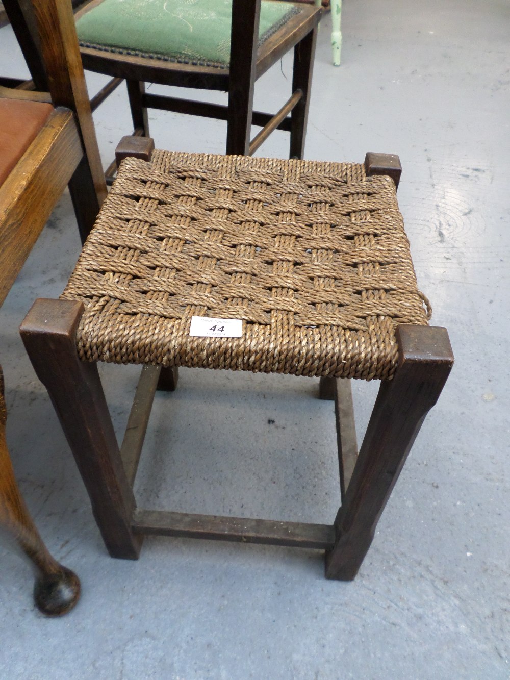 Small wooden stool with wicker seat