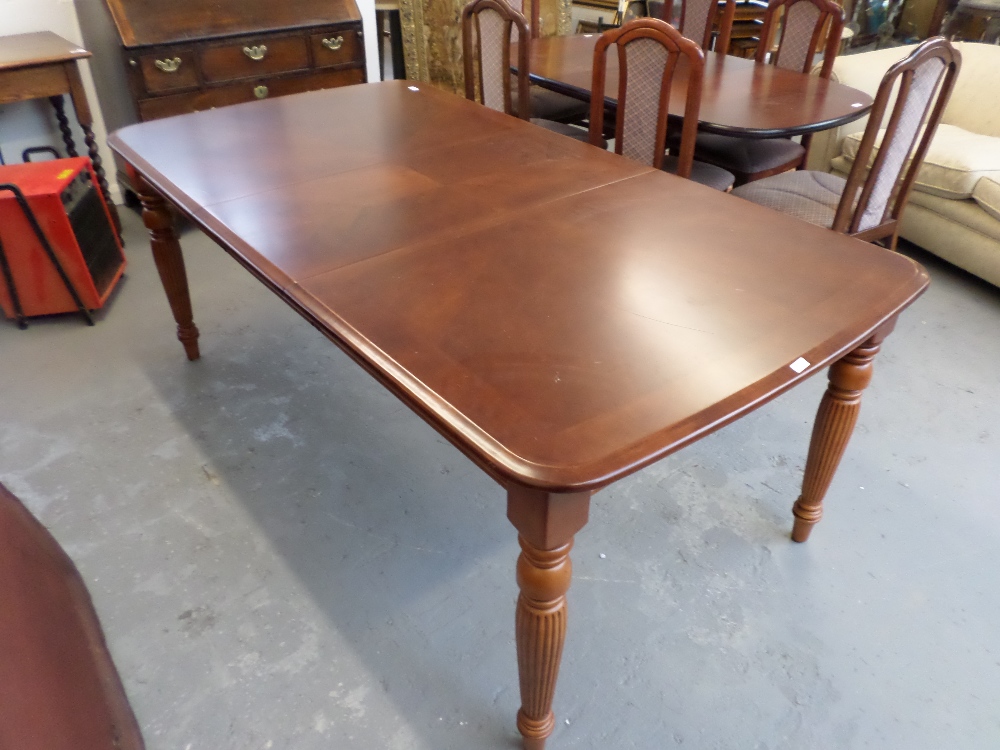 Mahogany extending dining table with one leaf (seats 10)