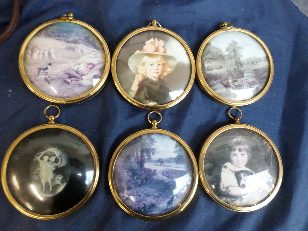 Collection of six glass minatures in brass frames of famous paintings