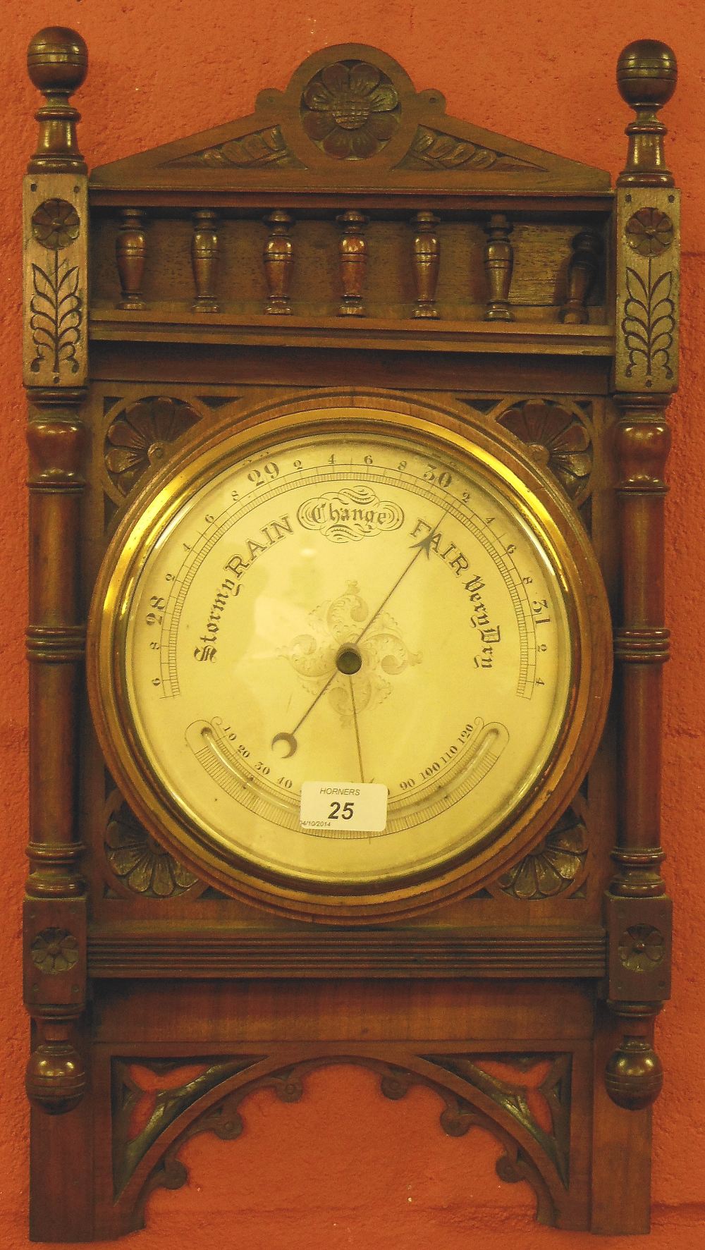 A VICTORIAN ANEROID BAROMETER, WITH CARVED WALNUT FRAME, 55CM