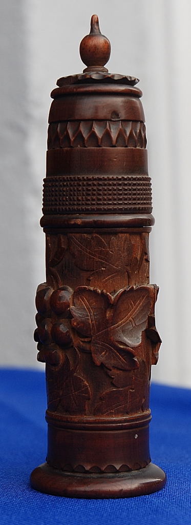 A VICTORIAN FRUITWOOD BOBBIN SEWING CASE AND COVER, CIRCA 1860, CARVED WITH FRUITING VINE