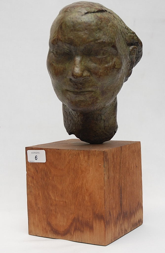 A BRONZE PORTRAIT HEAD OF A LADY