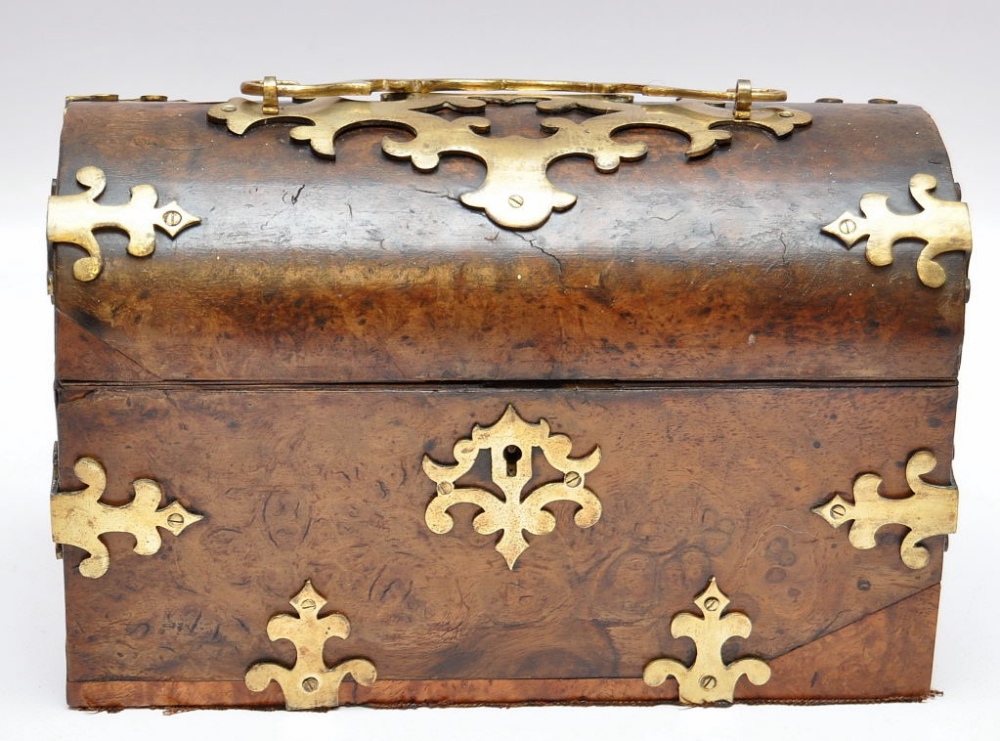 A WALNUT DOMED TOP STATIONERY BOX BURR WALNUT WITH APPLIED BRASS DECORATION, L. 23 CM APPROX