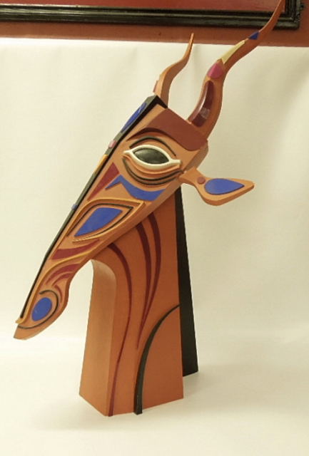 A CONTEMPORARY WOOD FORM SCULPTURE OF A GIRAFFE HEAD PAINTED AND DECORATED WITH APPLIED COLOURED - Image 2 of 2