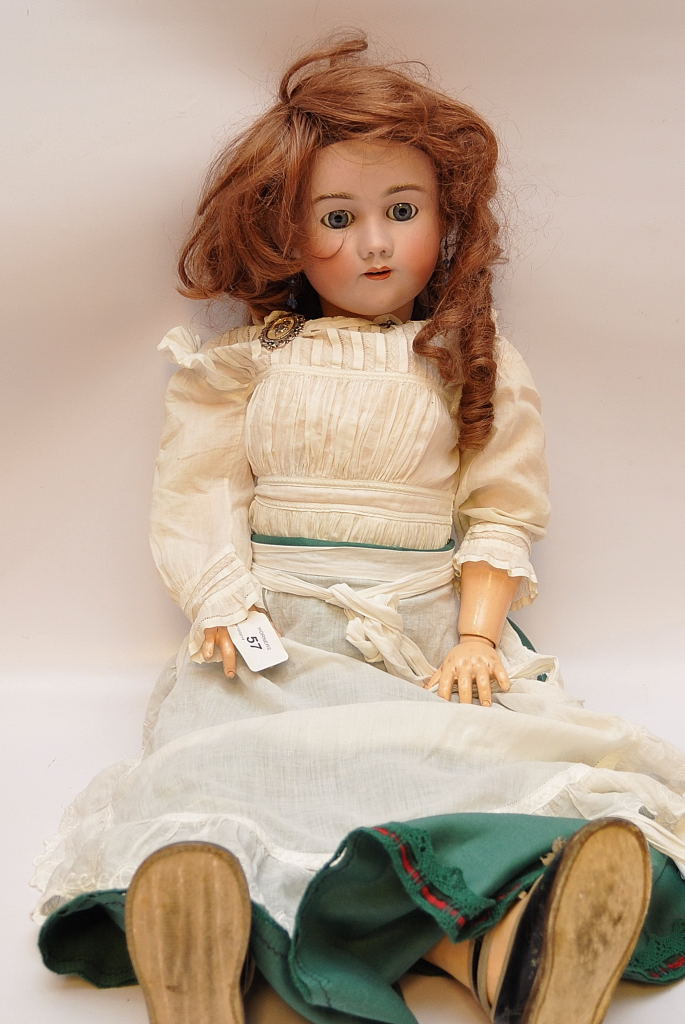 A HEINRICH HANDWERCK, SIMON AND HALBIG PORCELAIN HEADED DOLL WITH OPEN FIXED EYES, OPEN MOUTH,