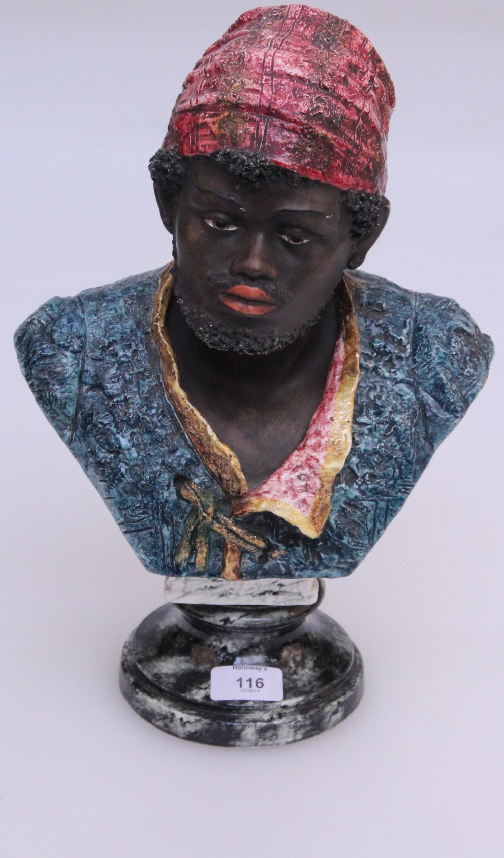 A ceramic bust of a young North African man, possibly Austrian c1910, polychrome decoration, raised