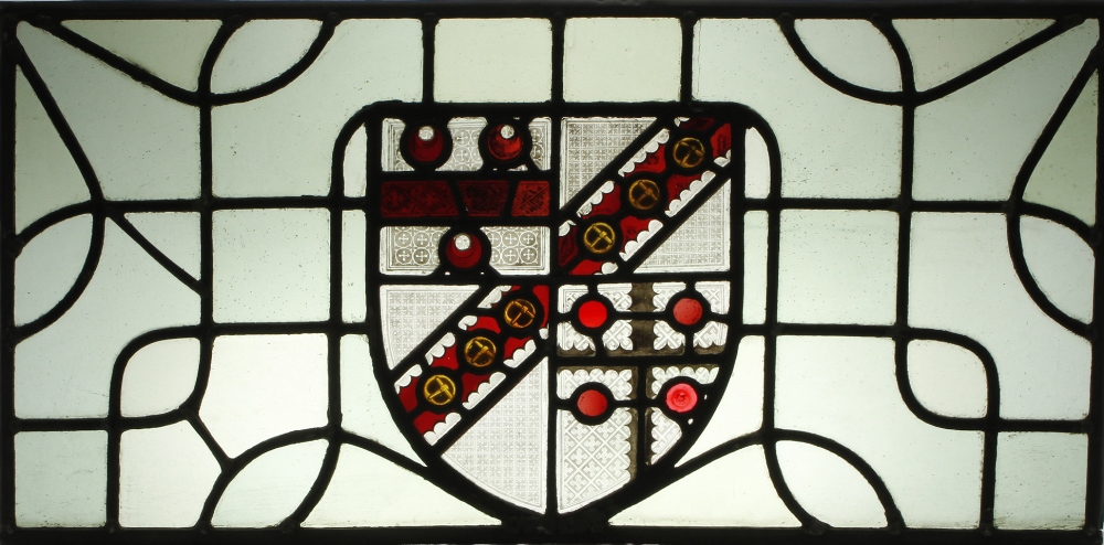 Three armorial stained and leaded glass panels, by Heaton, Butler and Bayne, one displaying a