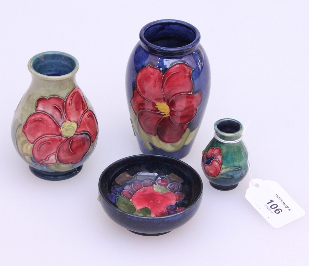 A miniature Moorcroft baluster form vase, tube lined anemone design on green/blue ground, 6 cm (2