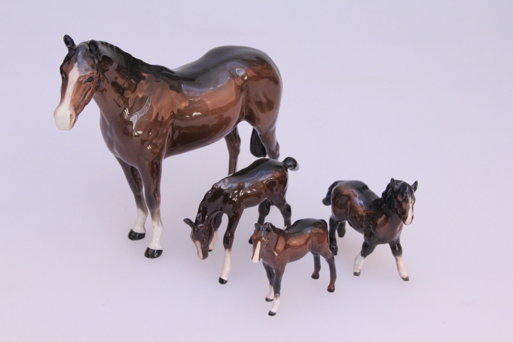 A Beswick pottery figure of a bay thoroughbred stallion, together with a Beswick mountain pony and