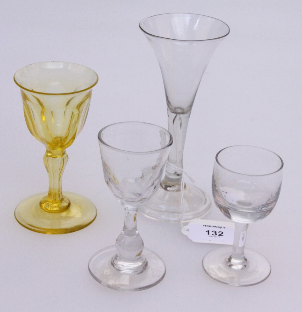 An 18th century conical clear glass ale glass, with teardrop inclusion to the plain conical stem,