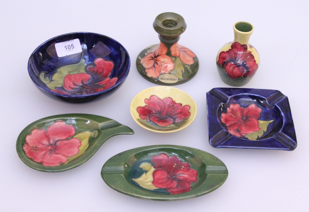 Seven pieces of Moorcroft, hibiscus pattern, various colour ways, of blue, green and yellow