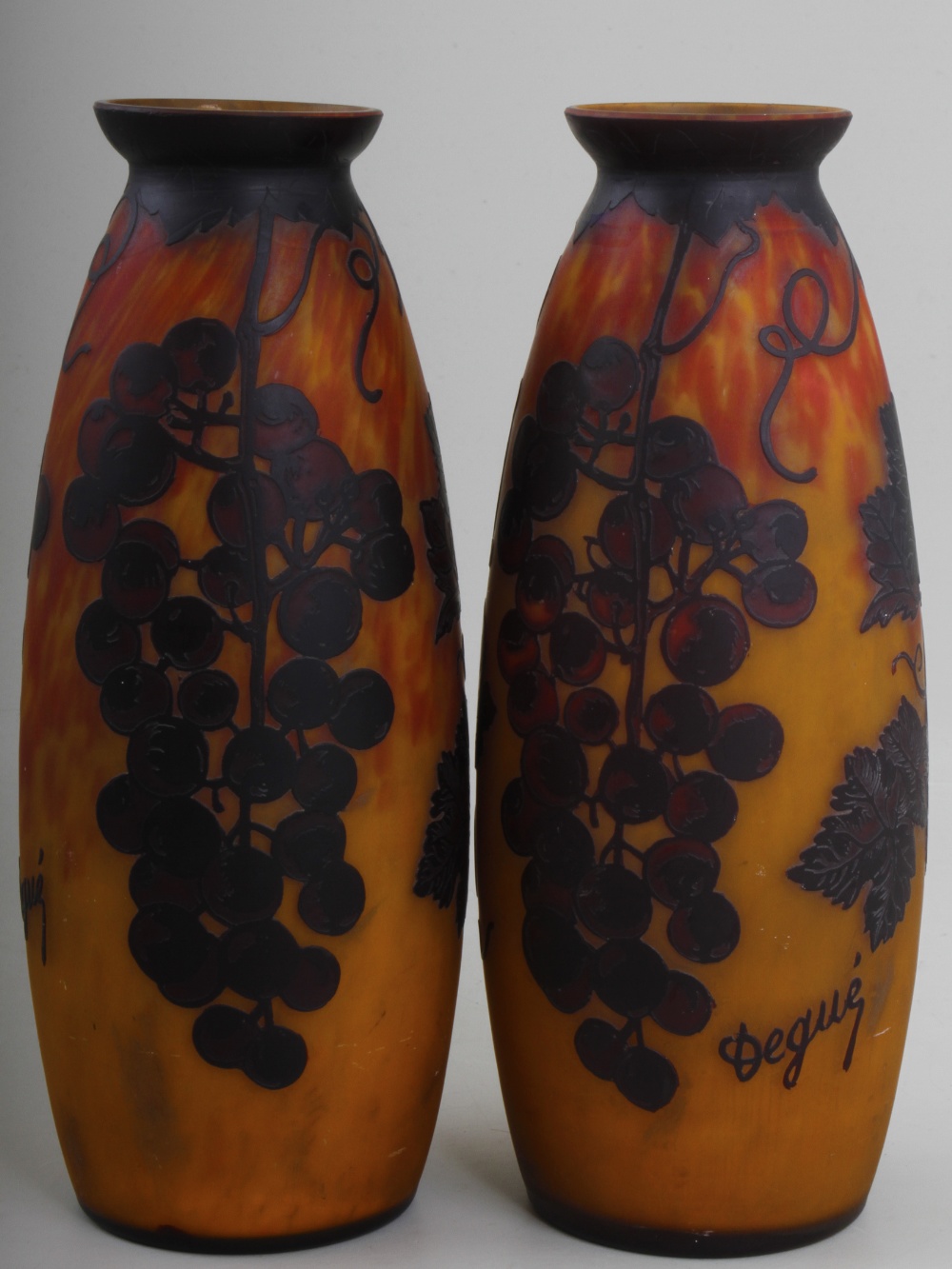 A pair of Degure cased and carved cameo glass gourd form vases, decorated with fruiting vines on a
