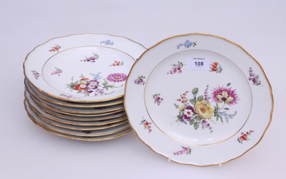 A set of ten late 19th century Meissen dessert plates, painted with cut blooms within gilt
