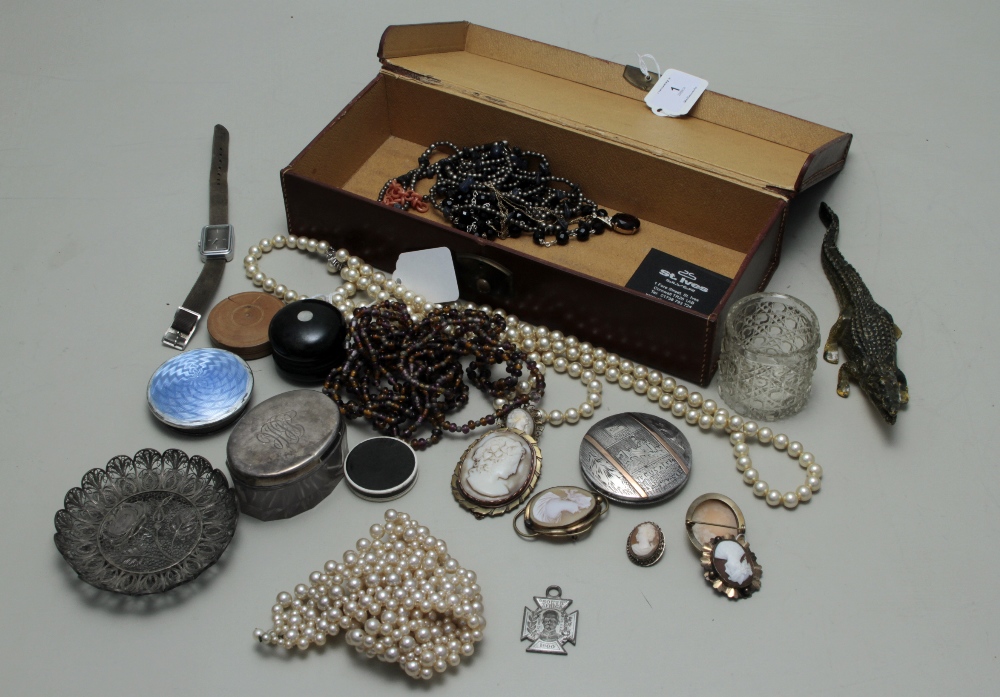 A leather case containing a mixture of items, to include costume jewellery, seal impressions,