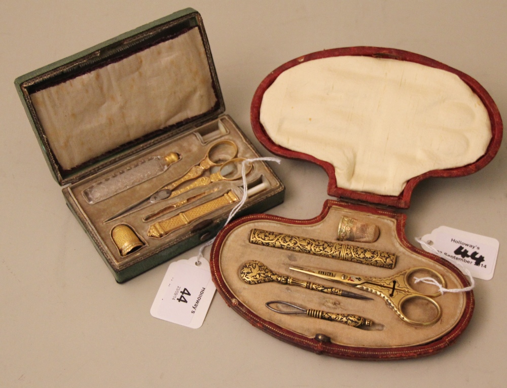 A 19th century yellow metal lady`s necessaire, comprising needlework thimble, fine nose scissors,