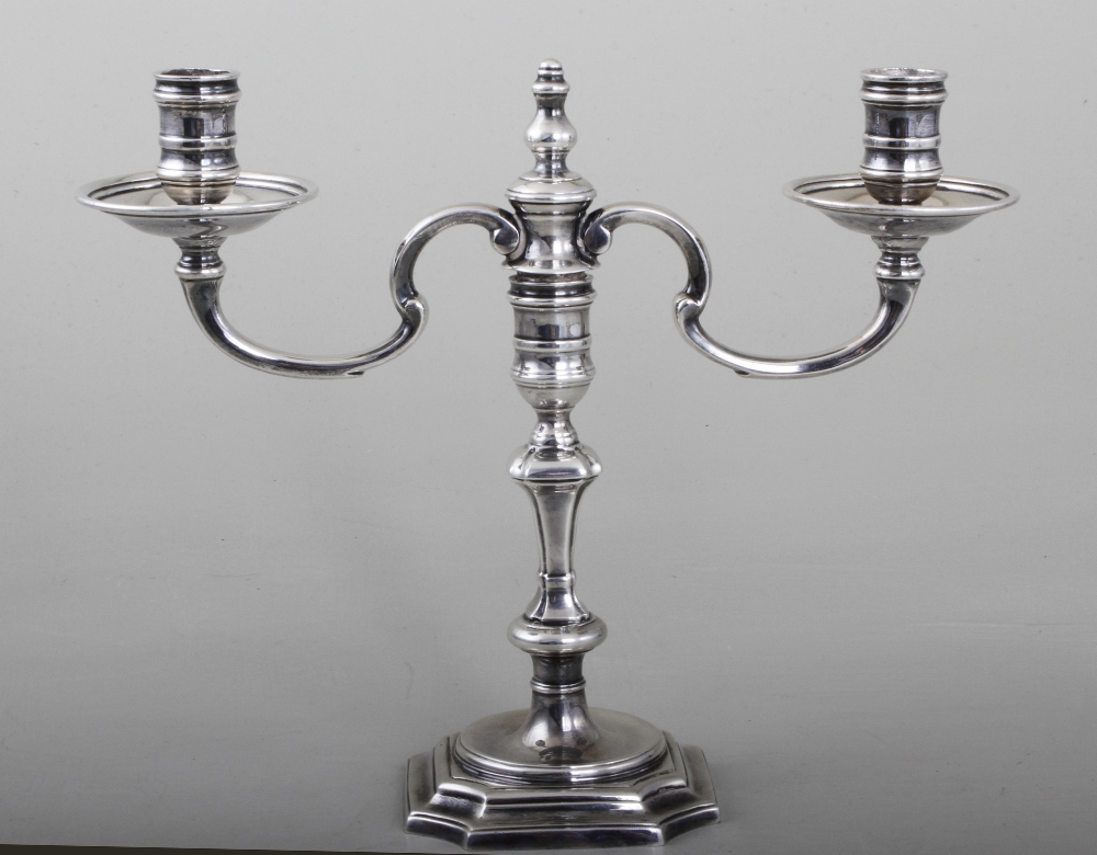 A Georgian design cast silver candelabra, the twin branch top removable turning the base into a