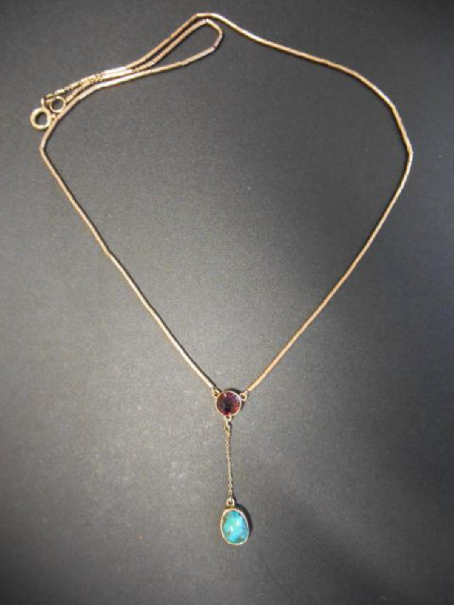 A vintage 9ct gold multi-layer gold necklace with amethyst and turquoise drops in open settings,