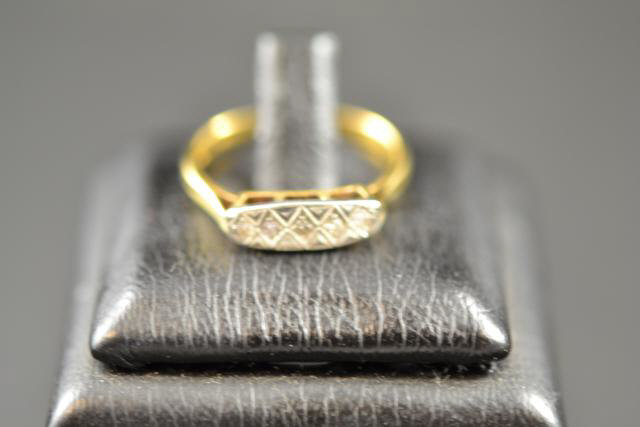 An 18ct gold and platinum ring set with five diamonds, c1920, size O - approx gross weight 2.6g