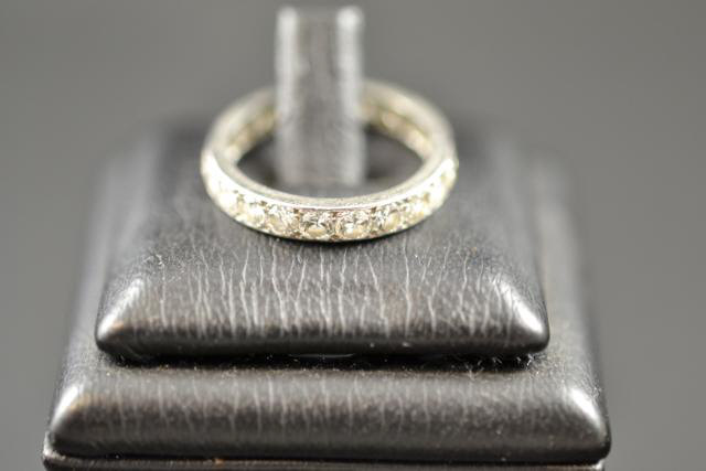 A platinum and diamond full eternity ring, size M - approx gross weight 3.5g -by repute given by