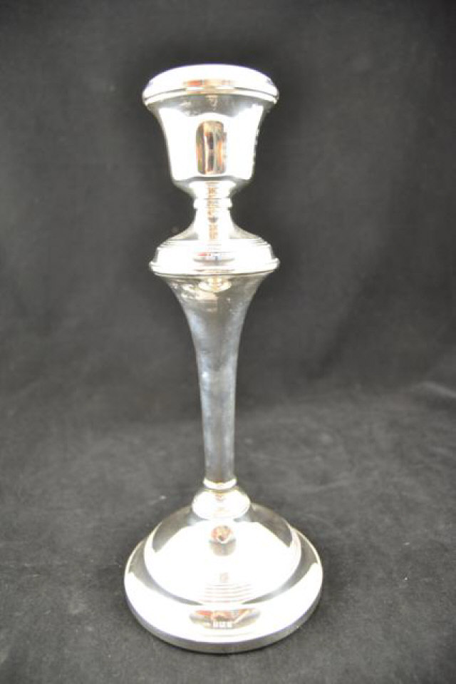 A mid 20th century filled silver presentation candlestick, Birmingham 1957, maker W I Broadway & Co