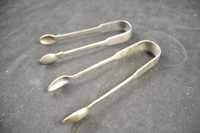 A pair of Georgian silver sugar tongs, London 1819, maker George Piercy, together with Victorian