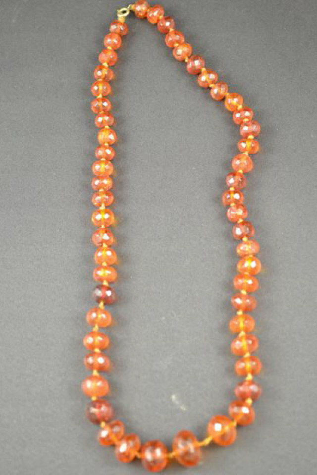 An amber faceted bead necklace, L58cm - approx gross weight 42g