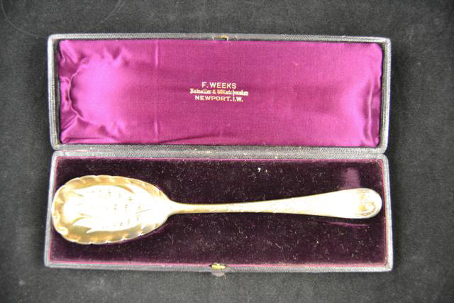 A Georgian silver gilt serving spoon engraved and embossed with harebell design, London 1773,