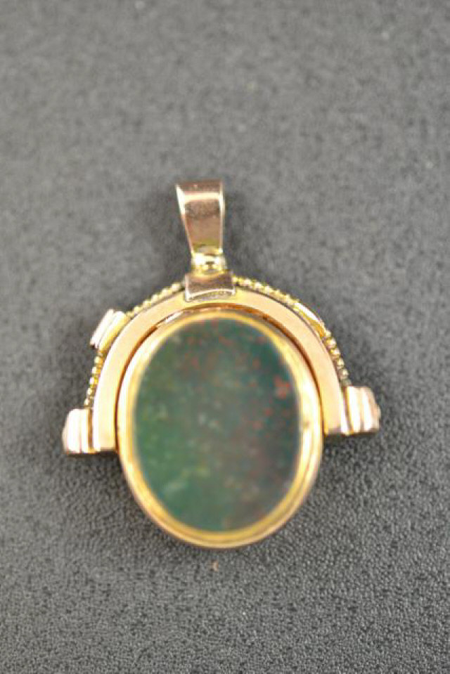 A 10ct gold rotating fob faced with semi-precious stones - approx gross weight 9.2g   CONDITION