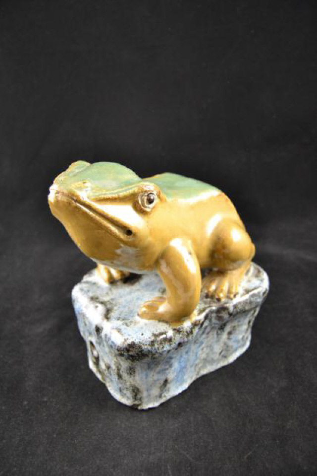 A 19th/early 20th Century faience toad decorated in green, brown and mottled blue - L21cm.