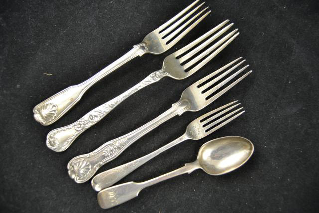 Two Victorian shell pattern forks, a small silver fork, a white metal fork, together with a